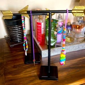 Tow arrow necklace stands and 3 JoJo necklaces